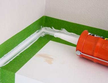 Line the edges of a caulked area with painter s tape