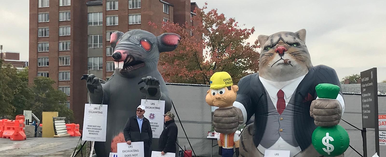 The giant inflatable rat that shows up at union protests has a name scabby