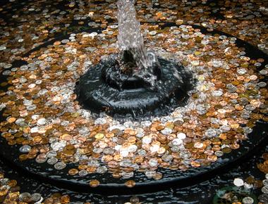 People toss coins into wishing wells and fountains as in ancient times water spirits and deities were thought to live in them