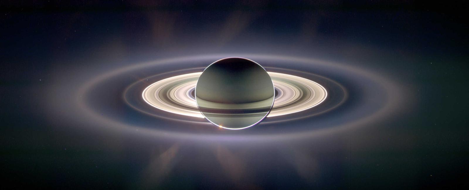 Saturn s rings made up of ice rock and dust are thought to be formed from pieces of asteroids comets and shattered moons