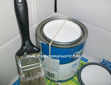 Remove excess paint from your brush with a rubber band