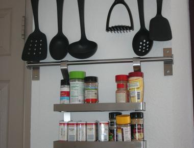 Hang cumbersome utensils on hooks inside cabinets too