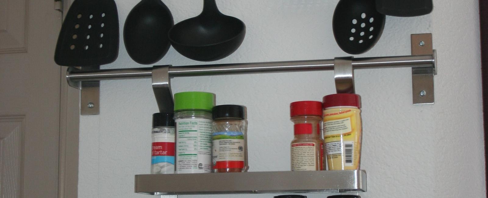 Hang cumbersome utensils on hooks inside cabinets too