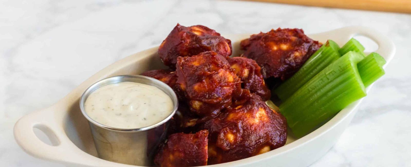 Cauliflower dipped in barbecue sauce tastes almost the same as chicken nuggets and it s infinitely healthier