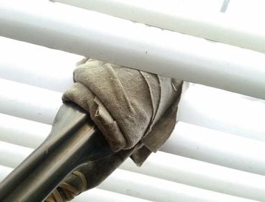 Use towel wrapped tongs to clean your blinds