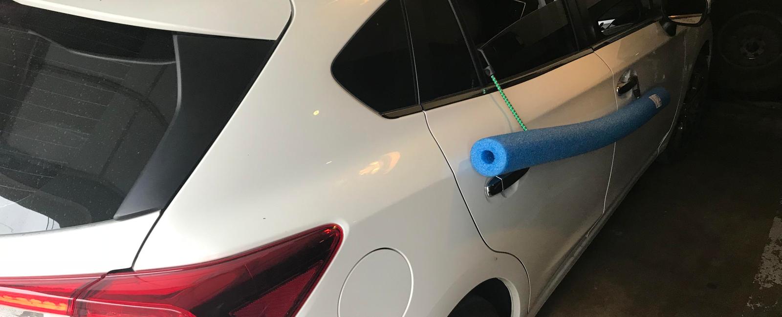 Use a foam noodle to prevent dings in your car door