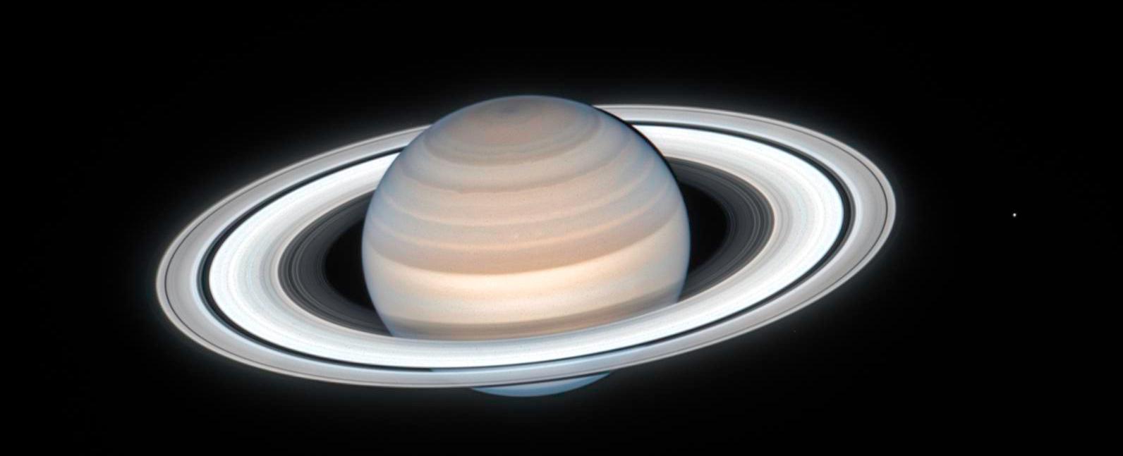 Saturn s southern hemisphere is cloudy while its northern hemisphere is clear as its clouds have sunk deeper into its atmosphere