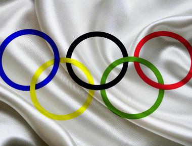 The olympic flag s colors are always red black blue green and yellow rings on a field of white this is because at least one of those colors appears on the flag of every nation on the planet