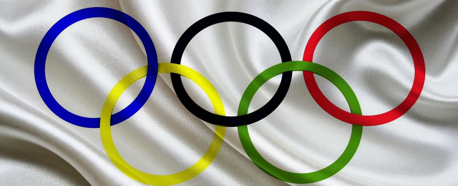 The olympic flag s colors are always red black blue green and yellow rings on a field of white this is because at least one of those colors appears on the flag of every nation on the planet