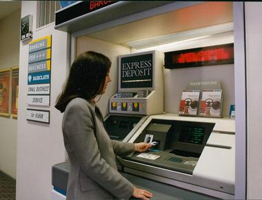 The automated teller machine atm was introduced in england in 1965