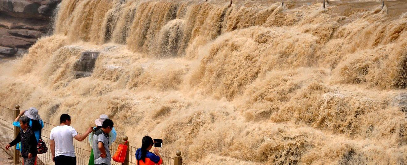 There are so many corpses floating in china s yellow river that some people have become body fishers and they make money by collecting the remains and selling it to their families