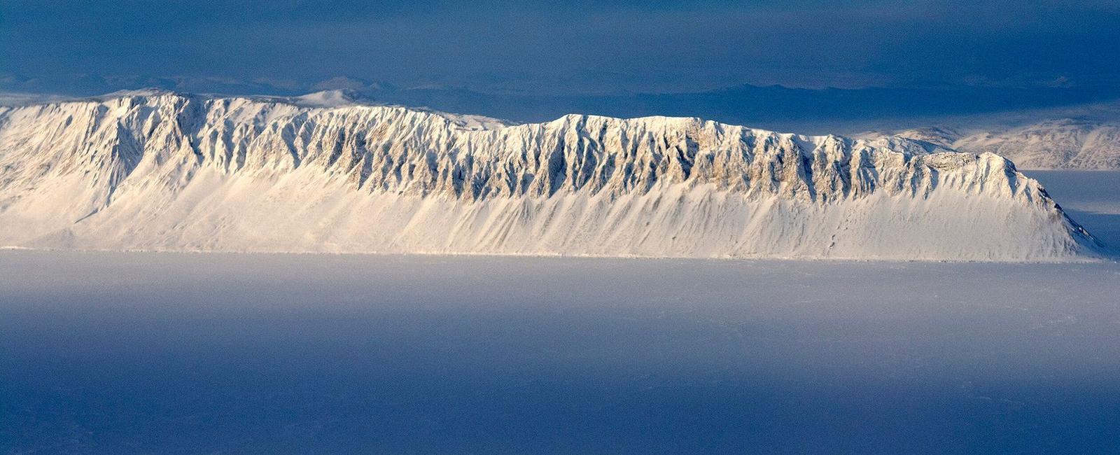 Canada s last fully intact ice shelf some 4 000 years old has broken off reducing the shelf by more than half after separating from the shelf the piece split in two forming an iceberg almost the size of manhattan