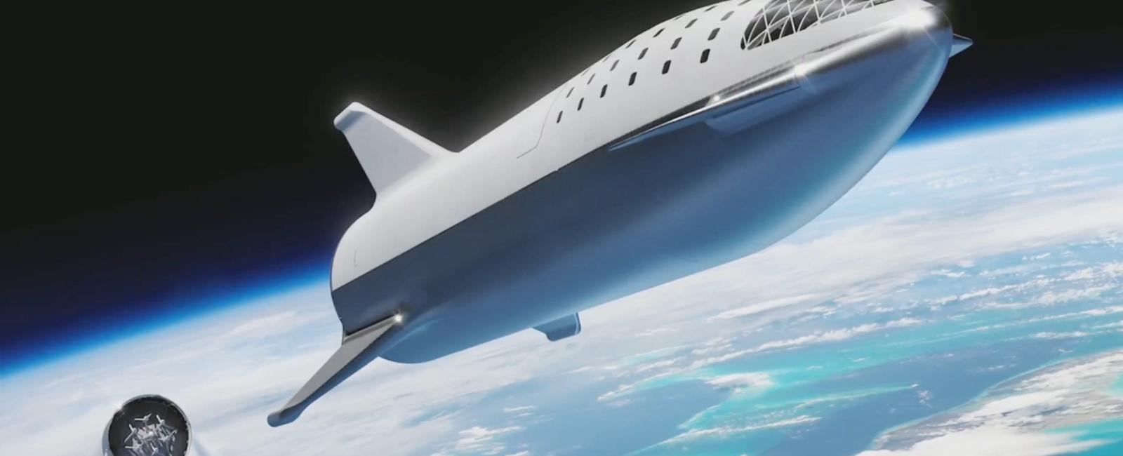 Elon musk unveils spacex spacecraft starship designed to travel to mars and the solar system and land back on earth