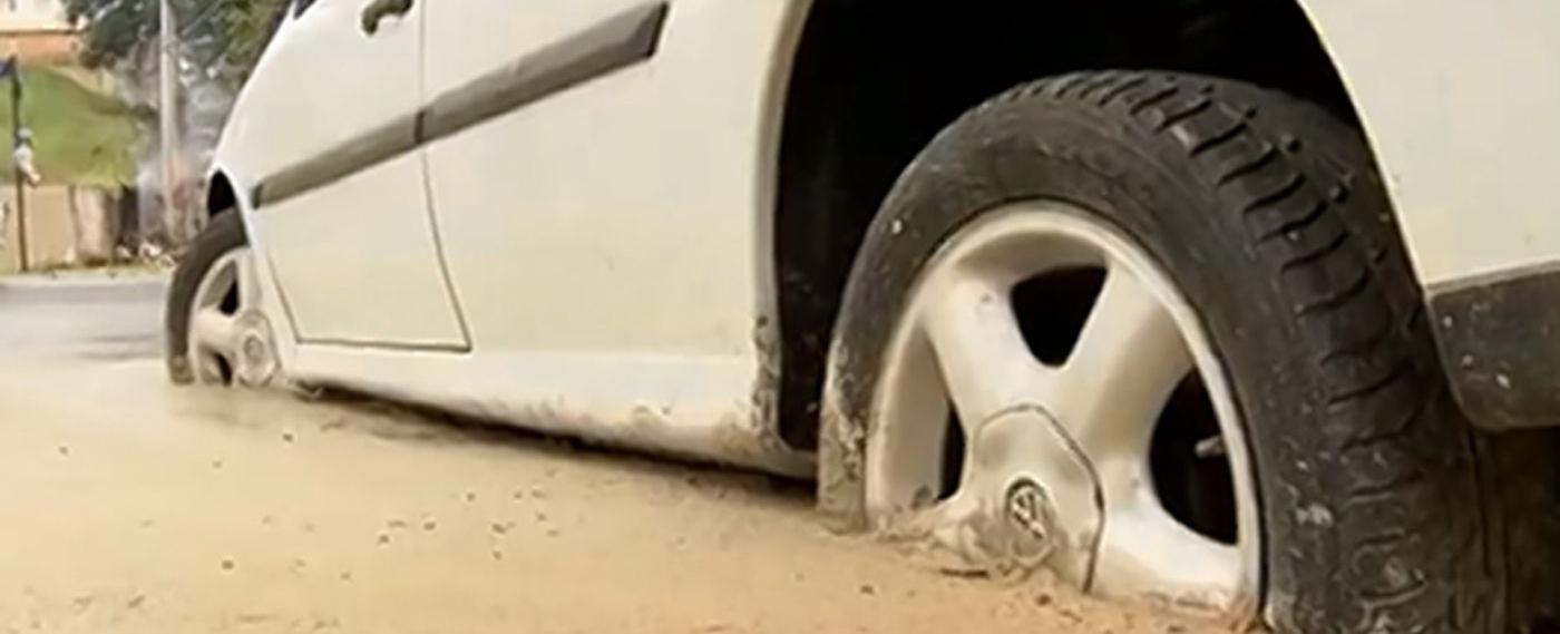 Construction workers in brazil cemented a car on a pavement after its driver refused to move it