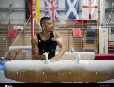 A british gymnast survived a fall from a fourth story window because he went into a somersault and came down on two feet